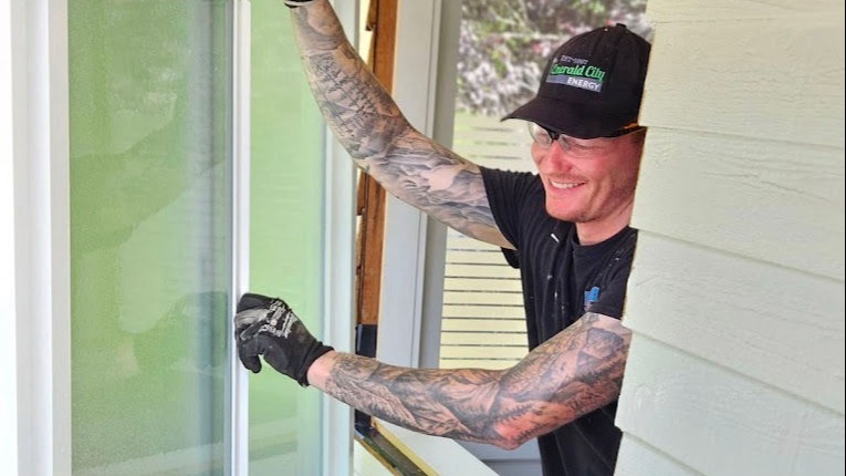 Emerald City Energy installer fitting an energy-efficient replacement window in a Everett, WA home
