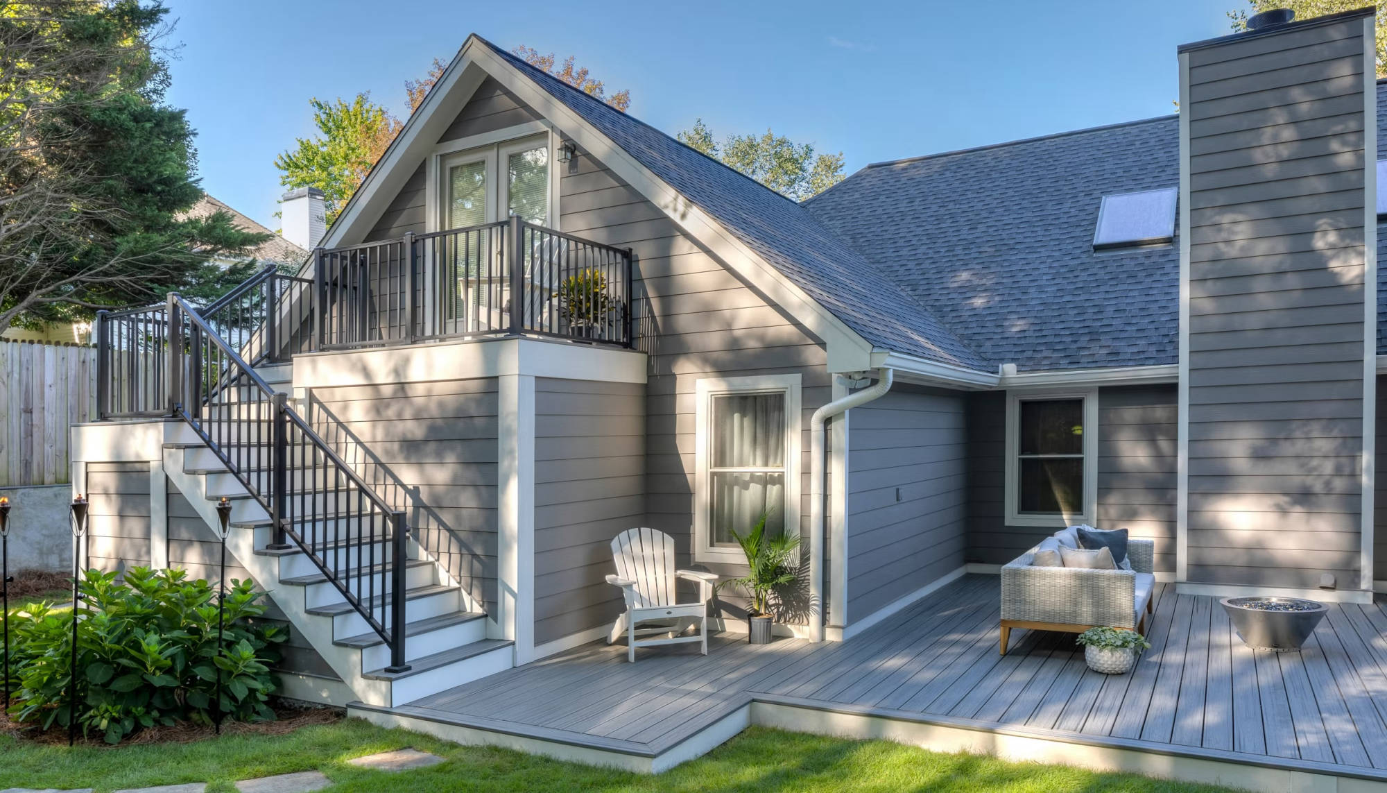 Backyard composite Trex deck with railing and outdoor living space